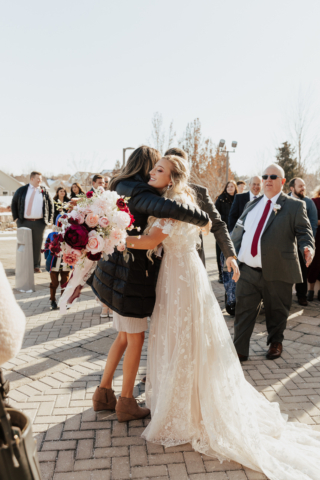 A young and adventurous couple dresses up in their groom and bridal wedding attire on their wedding day. They were photographed by Hannah Lylene Photography, a Dallas Fort Worth (DFW) Elopement/Wedding photographer as a part of their intimate elopement/wedding Latter Day Saint (LDS) ceremony.