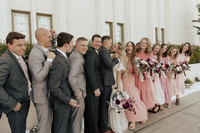 A couple dresses up in their wedding attire on their wedding day to take their candid and natural documentary styled photos with their bridal party. Photographed by Northern Texas (DFW) photographer Hannah Lylene Photography.