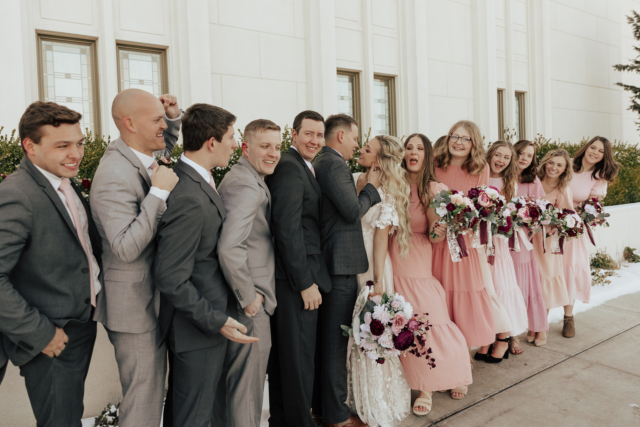 A couple dresses up in their wedding attire on their wedding day to take their candid and natural documentary styled photos with their bridal party. Photographed by Northern Texas (DFW) photographer Hannah Lylene Photography.