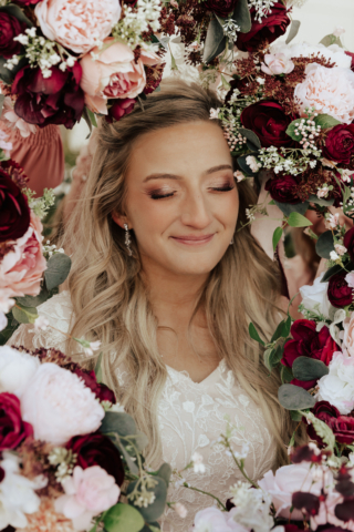 A couple dresses up in their wedding attire on their wedding day to take their romantic and natural documentary styled photos. Photographed by Hannah Lylene Photography.