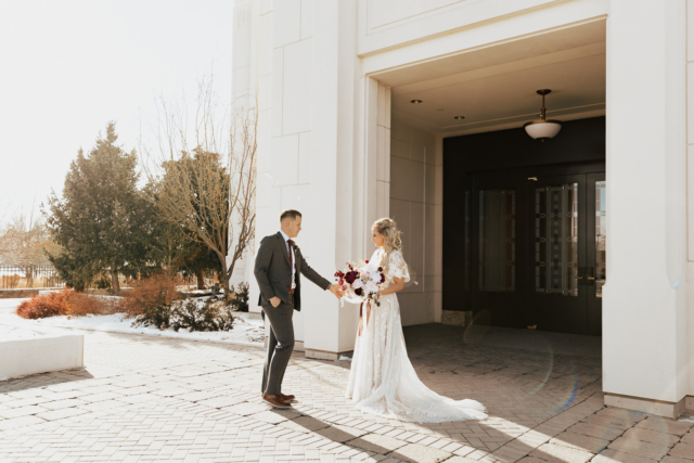 A couple dresses up in their wedding attire on their wedding day to take their romantic and natural documentary styled photos. Photographed by Hannah Lylene Photography.