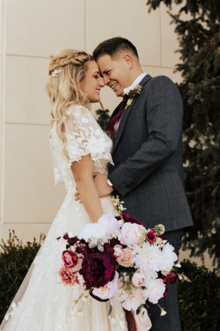 A couple dresses up in their wedding attire on their wedding day to take their romantic and natural documentary styled photos. Photographed by Hannah Lylene Photography.