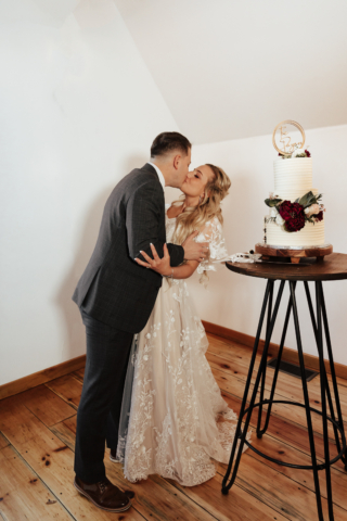 A couple dresses up in their wedding attire on their wedding day to take their romantic and natural documentary styled photos. Photographed by Hannah Lylene Photography.