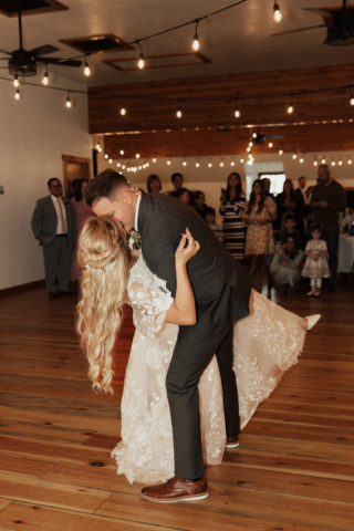 A couple dresses up in their wedding attire on their wedding day to take their romantic and natural documentary styled flash photos. Photographed by Hannah Lylene Photography.