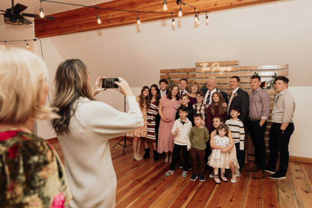 Candid and documentary style photos of wedding guests interacting with couple on their wedding day. Photographed by Northern Texas (DFW) photographer Hannah Lylene Photography.