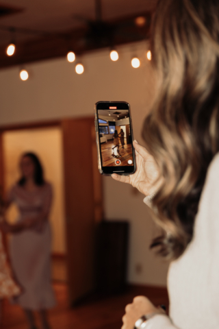 Candid and documentary style photos of wedding guests interacting with couple on their wedding day. Photographed by Northern Texas (DFW) photographer Hannah Lylene Photography.