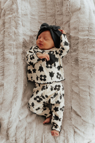 Details of a newborn baby’s face while being held by their parents. Photography by Dallas Photographer Hannah Lylene Photography