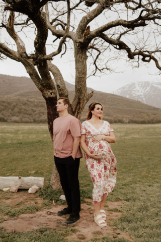 A pregnant mother and father in the Northern Texas mountains taking their maternity photos. Photography by Dallas Photographer Hannah Lylene Photography