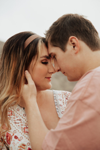 A pregnant mother and father in the Northern Texas mountains taking their maternity photos. Photography by Dallas Photographer Hannah Lylene Photography