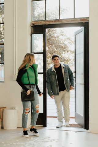 0N4A4919 A couple in neutral attire at the Lumen Room Studio in Fort Worth, Texas get engaged surrounded by baby’s breath. Photography by Hannah Lylene Photography.