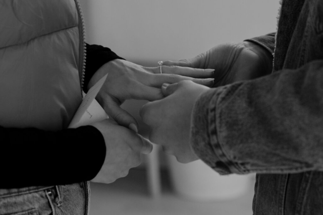0N4A4984-2 A close up shot a solitare round cut cut diamond ring at the Lumen Room studio.