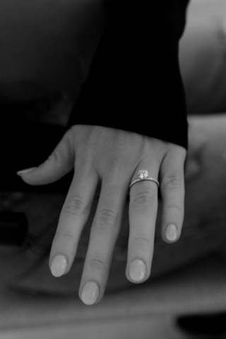 0N4A5043-For Web-2 A couple in neutral attire at the Lumen Room Studio in Fort Worth, Texas get engaged surrounded by baby’s breath. Photography by Hannah Lylene Photography.