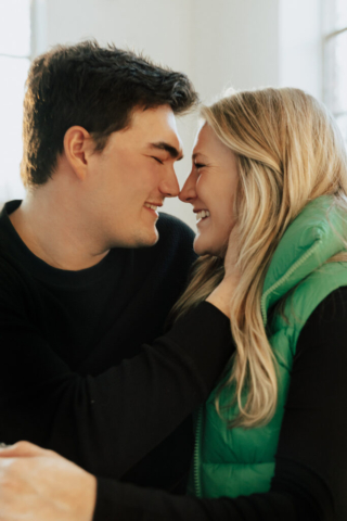 0N4A5151-Edit A couple in neutral attire at the Lumen Room Studio in Fort Worth, Texas get engaged surrounded by baby’s breath. Photography by Hannah Lylene Photography.