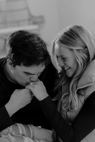 0N4A5176-Edit-For Web-2 A couple in neutral attire at the Lumen Room Studio in Fort Worth, Texas get engaged surrounded by baby’s breath. Photography by Hannah Lylene Photography.
