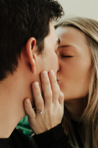 0N4A5288-Edit A couple in neutral attire at the Lumen Room Studio in Fort Worth, Texas get engaged surrounded by baby’s breath. Photography by Hannah Lylene Photography.