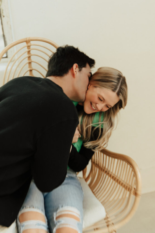 0N4A5332 A couple in neutral attire at the Lumen Room Studio in Fort Worth, Texas get engaged surrounded by baby’s breath. Photography by Hannah Lylene Photography.