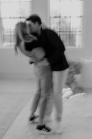 0N4A5471 A couple in neutral attire at the Lumen Room Studio in Fort Worth, Texas get engaged surrounded by baby’s breath. Photography by Hannah Lylene Photography.