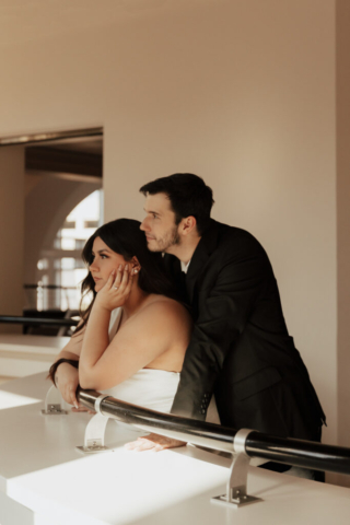 hannah-lylene-fort-worth-dallas-wedding-photography A couple in neutral attire at Bass Hall kiss and run around for engagement photos.