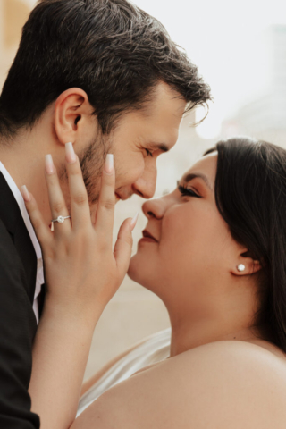 classy-natural-engagement-photography-hannah-lylene A couple in neutral attire at Bass Hall kiss and run around for engagement photos.