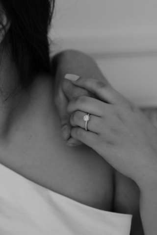 circle-diamond-modern-wedding-ring A couple in neutral attire at Bass Hall kiss and run around for engagement photos.
