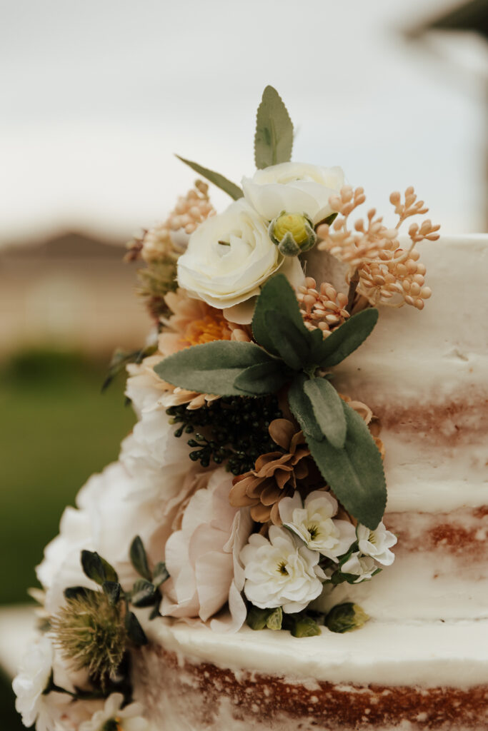 Naked Wedding Cake with Neutral and Warm Florals
