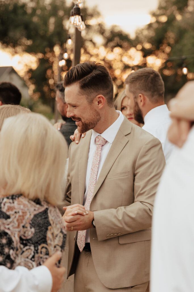 Candid and documentary style photos of wedding guests interacting with couples on their wedding day