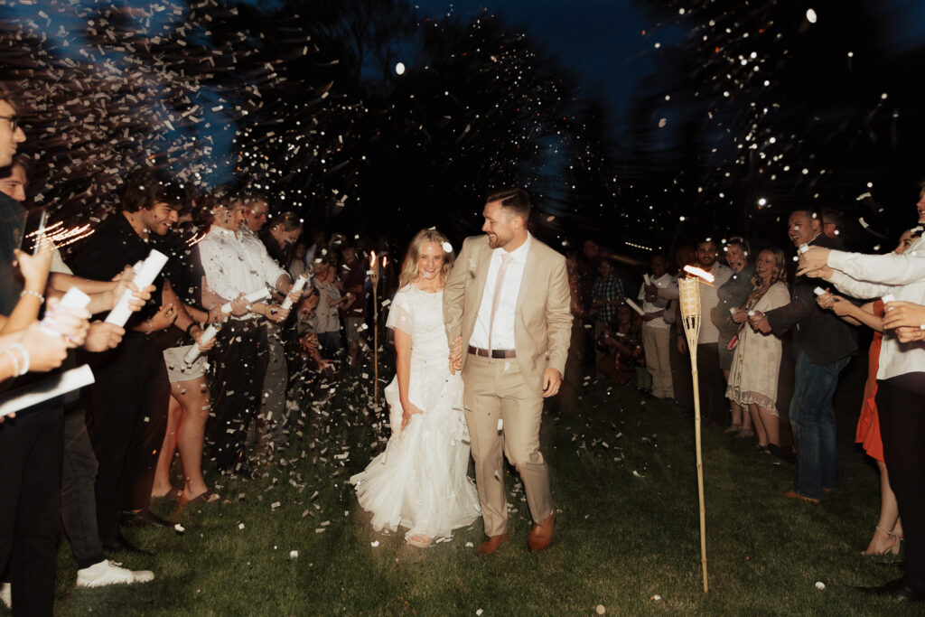 Bride and Groom during their confetti wedding exit from their DFW Intimate Wedding Elopement