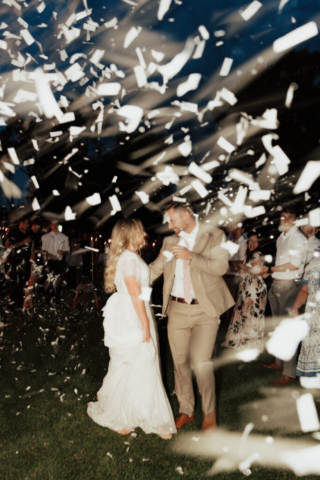 Hannah-Lylene-Dallas-Fort-Worth-Wedding-Elopement-Photographer Bride and Groom during their confetti wedding exit from their DFW Intimate Wedding Elopement