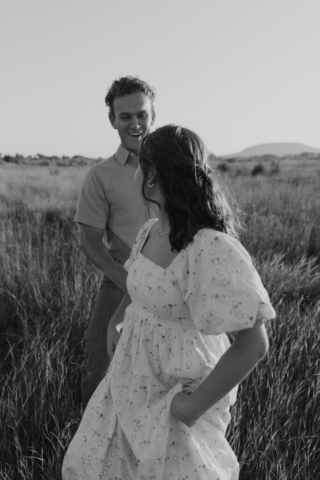 Young couples holds hands during their engagement session
