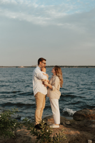 A boy and girl with their son having their family photography session in Grapevine, Texas.