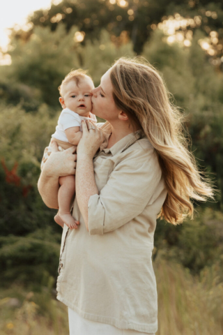 A boy and girl with their son having their family photography session in Grapevine, Texas.
