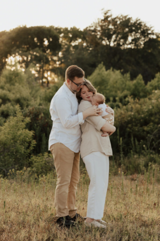 A boy and girl with their son having their family photography session in Grapevine, Texas.
