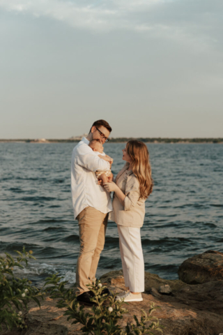A boy and girl with their son having their family photography session in Grapevine, Texas.