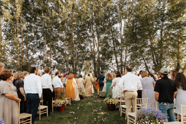 Celtic wedding ceremony in the backyard with garden flowers