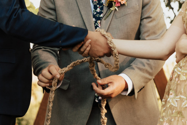 A Celtic Knot ceremony is performed during a outdoor micro-wedding in Dallas, Texas