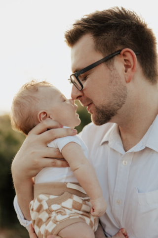 A boy and girl with their son having their family photography session in Grapevine, Texas.
