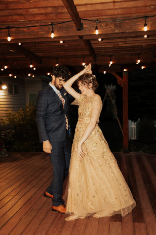 Outdoor backyard wedding ceremony dance party with night time flash photography