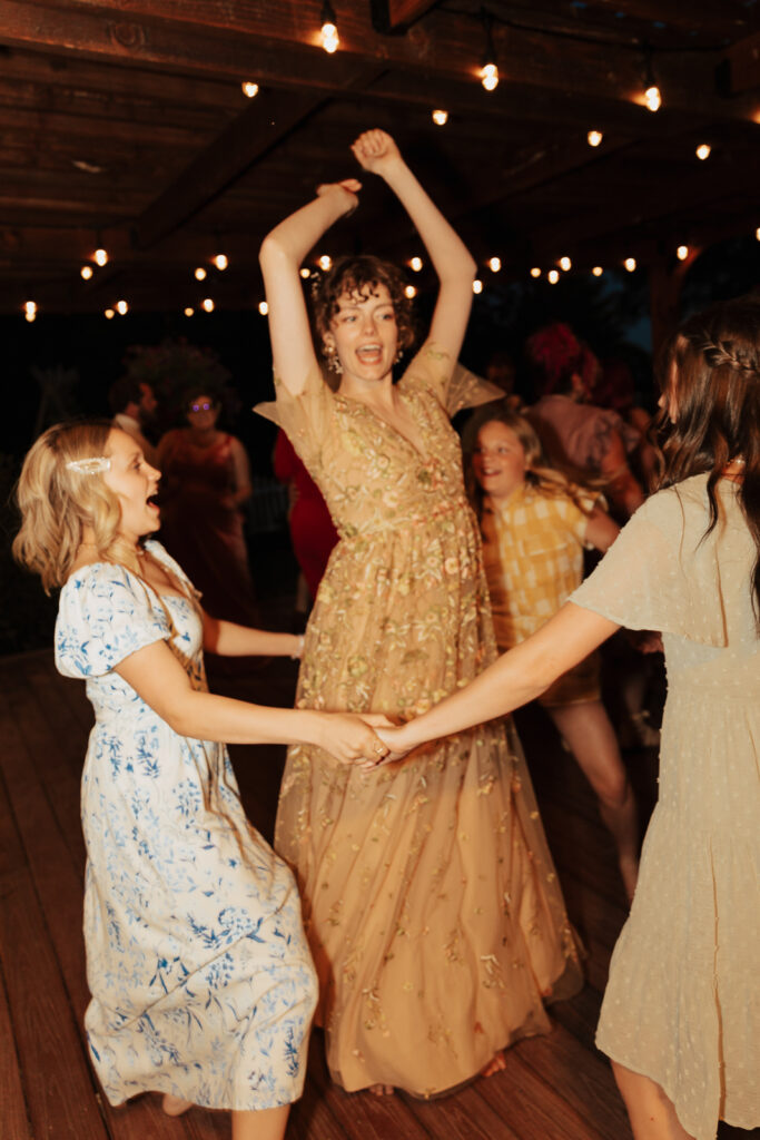 Outdoor backyard wedding ceremony dance party with night time flash photography