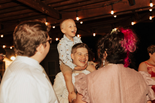 Outdoor backyard wedding ceremony dance party with night time flash photography