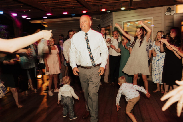 Outdoor backyard wedding ceremony dance reception with night time flash photography