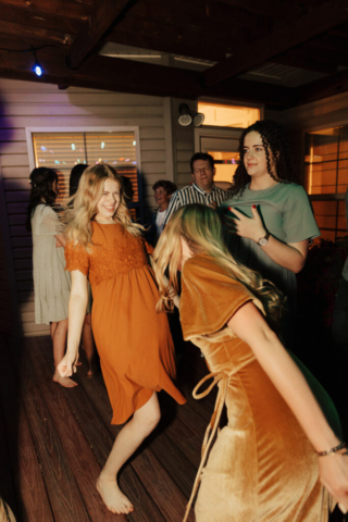 Outdoor backyard wedding ceremony dance reception with night time flash photography