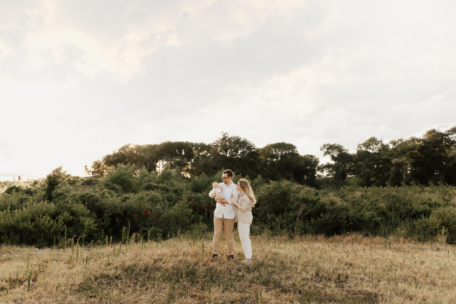 A boy and girl with their son having their family photography session in Grapevine, Texas.