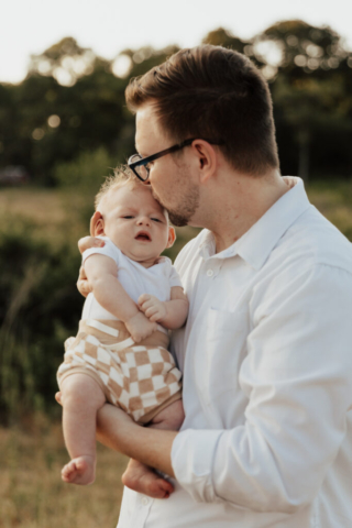 A boy and girl with their son having their family photography session in Grapevine, Texas.