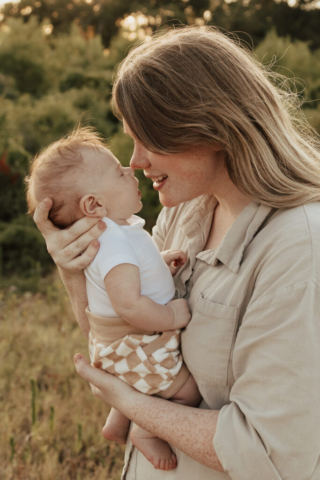 A boy and girl with their son having their family photography session in Grapevine, Texas.