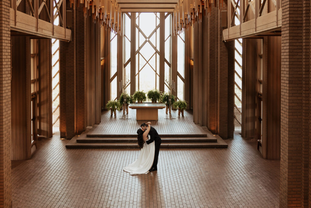 A young bride and groom at Marty Leonard Chapel on their intimate wedding day in Fort Worth, Texas.