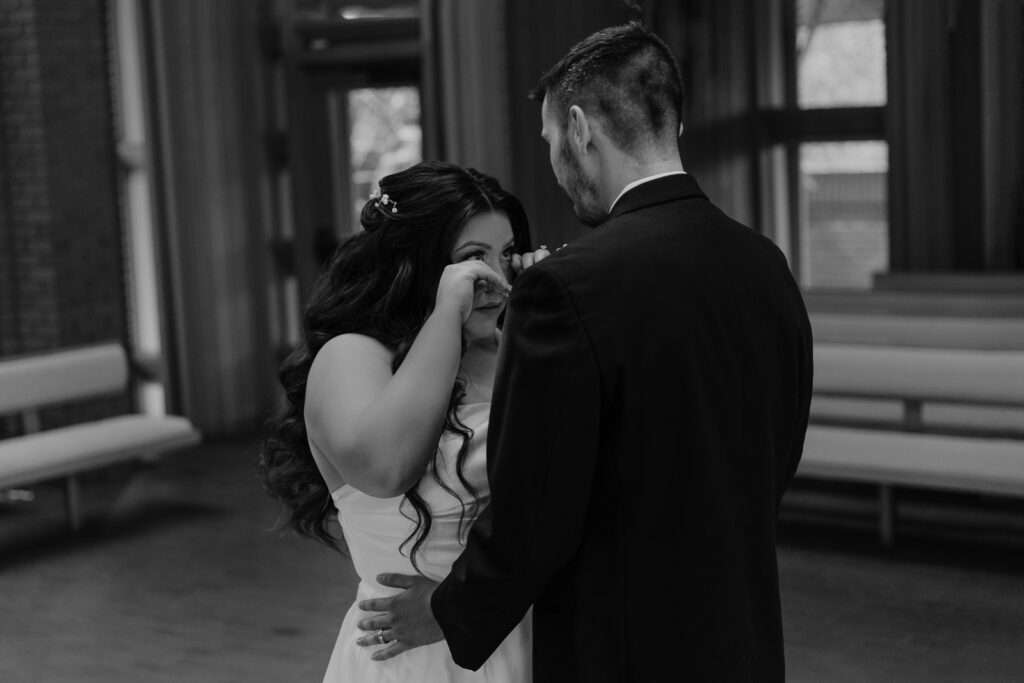 A young bride and groom at Marty Leonard Chapel on their intimate wedding day in Fort Worth, Texas.