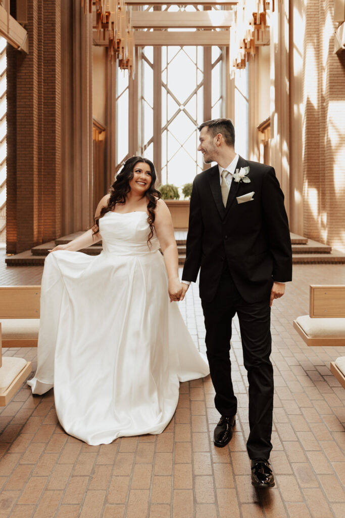 A young bride and groom at Marty Leonard Chapel on their intimate wedding day in Fort Worth, Texas.