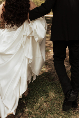 A young bride and groom at Marty Leonard Chapel on their intimate wedding day in Fort Worth, Texas.