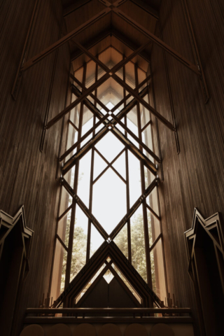 unique-chapel-window A young bride and groom at Marty Leonard Chapel on their intimate wedding day in Fort Worth, Texas.