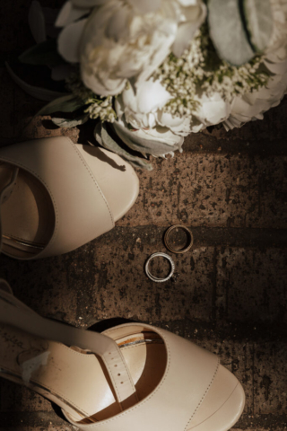 wedding-details-dramatic-light A young bride and groom at Marty Leonard Chapel on their intimate wedding day in Fort Worth, Texas.